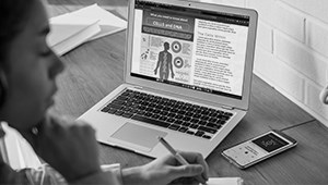 AlamoONLINE student taking notes from virtual class