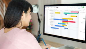 AlamoONLINE student facing computer while studying