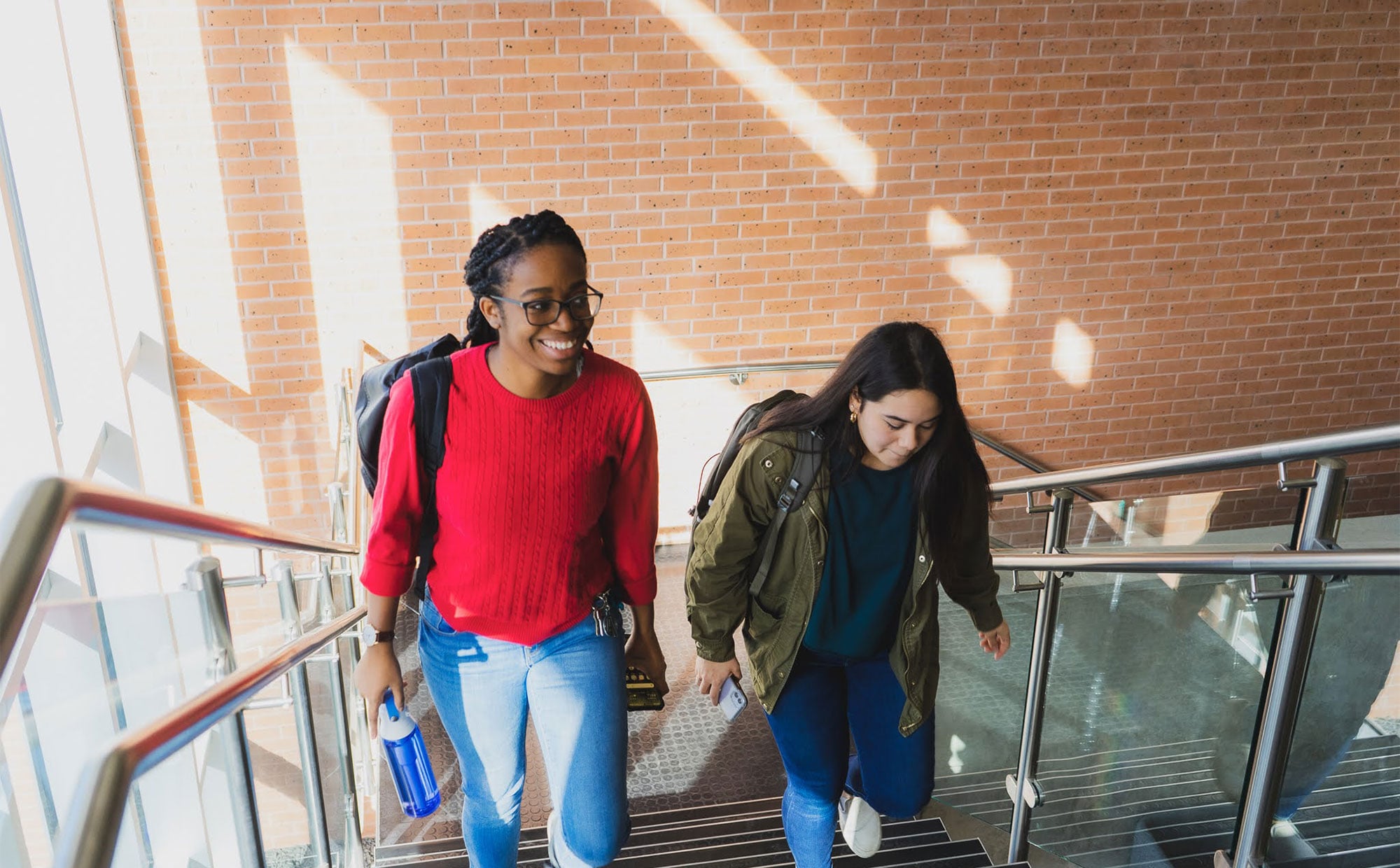 diverse students walking up stairs