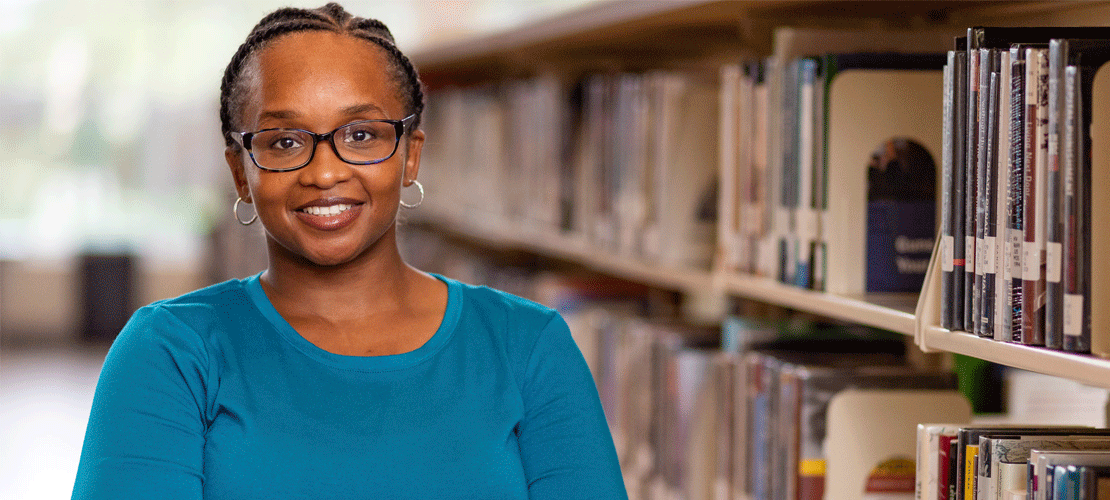Smiling student in library
