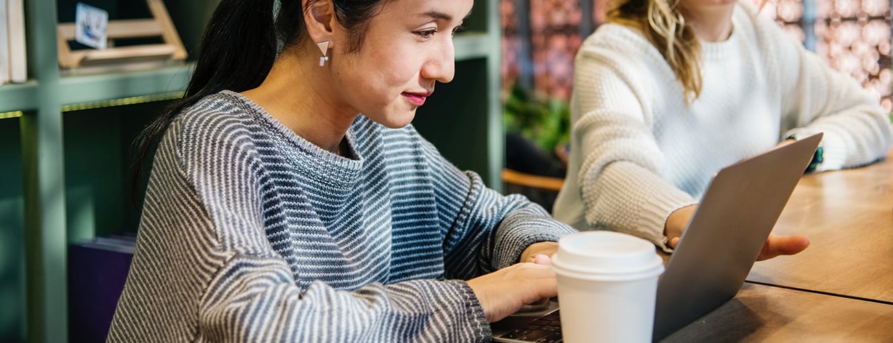 Woman looking on laptop