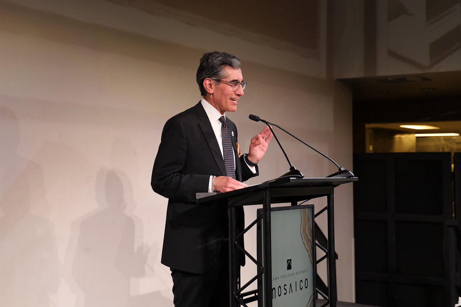 Dr. Flores speaking at podium