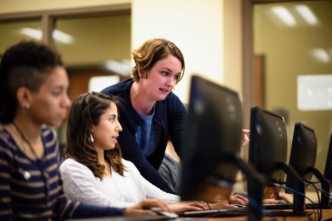 Alamo Colleges District faculty helping out students in the classrooom