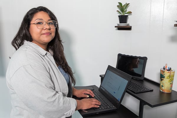 AlamoONLINE student ambassador smiling in her study space
