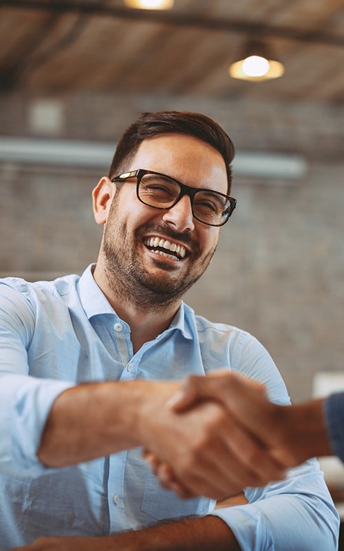 male student smiling shaking hands image