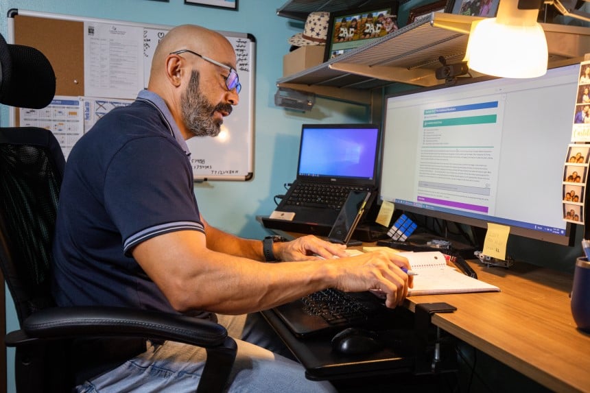 AlamoONLINE male student studying on their desktop