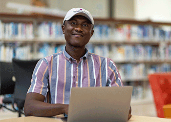 Alamo Colleges student in the library