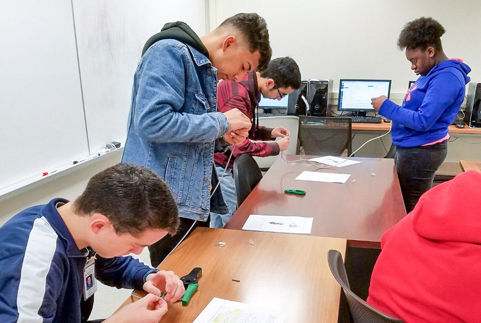 Alamo Academies students working in a lab with computers
