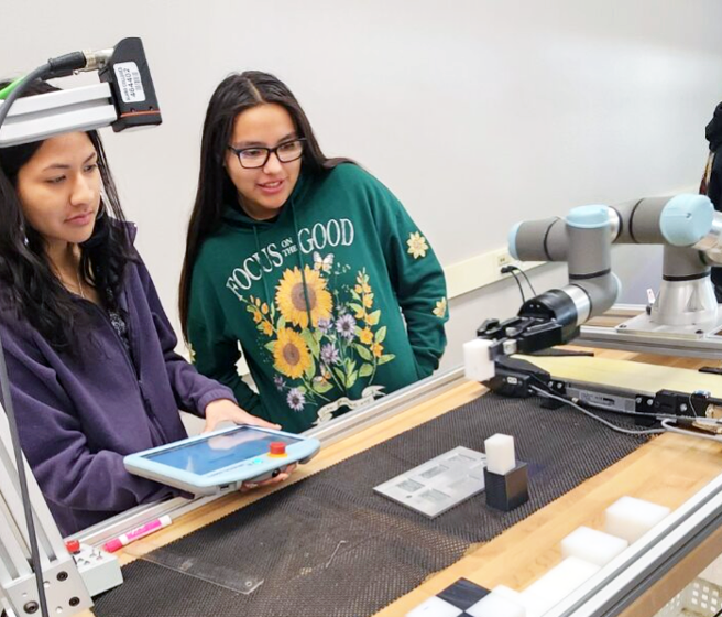 two female students in mechanical lab