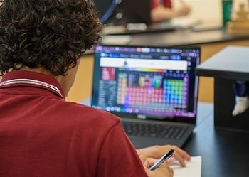 Student taking notes