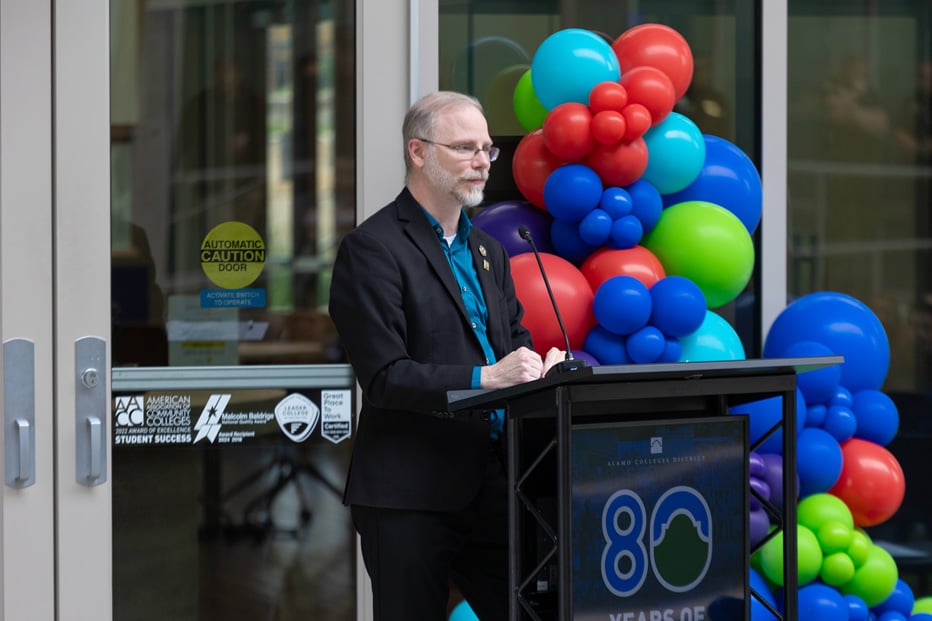 Man standing at podium speaking