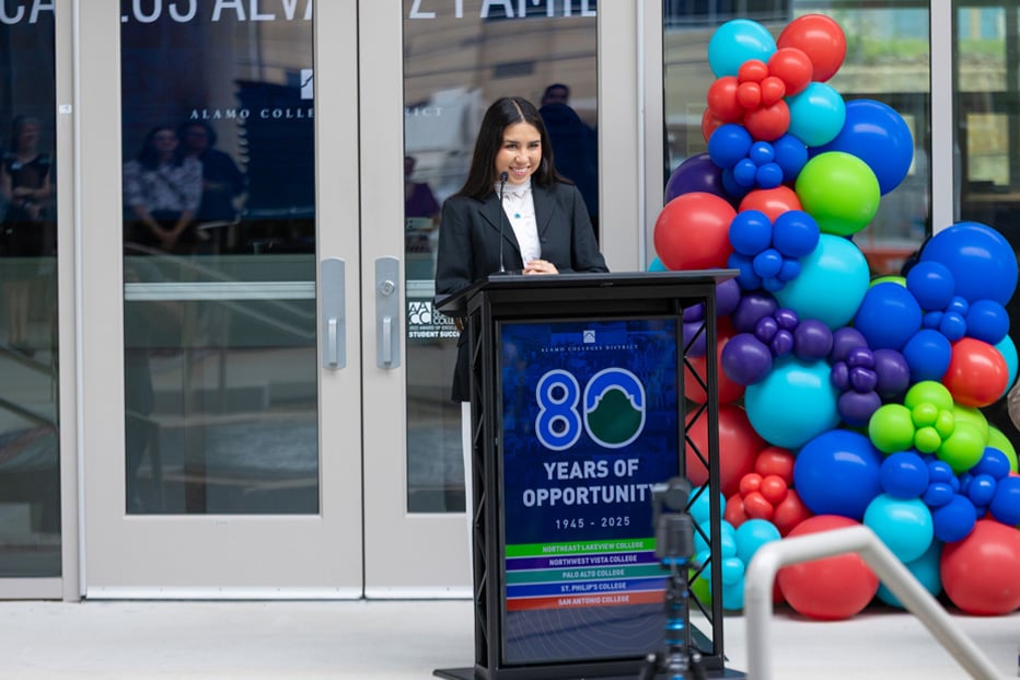 female student speaking at podium