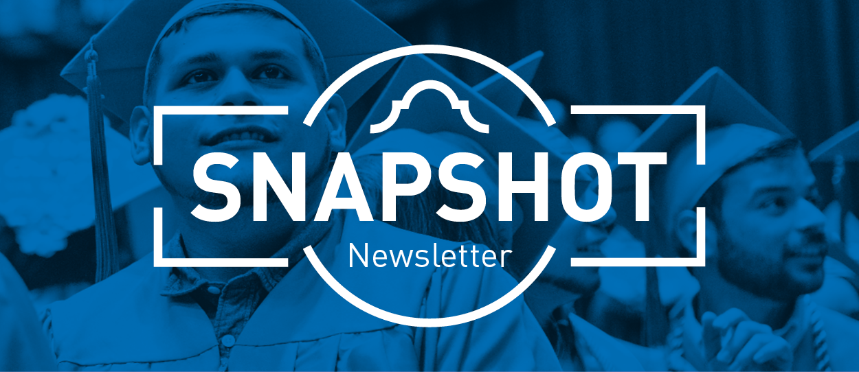 Photo of graduates with Snapshot Archive Logo in front