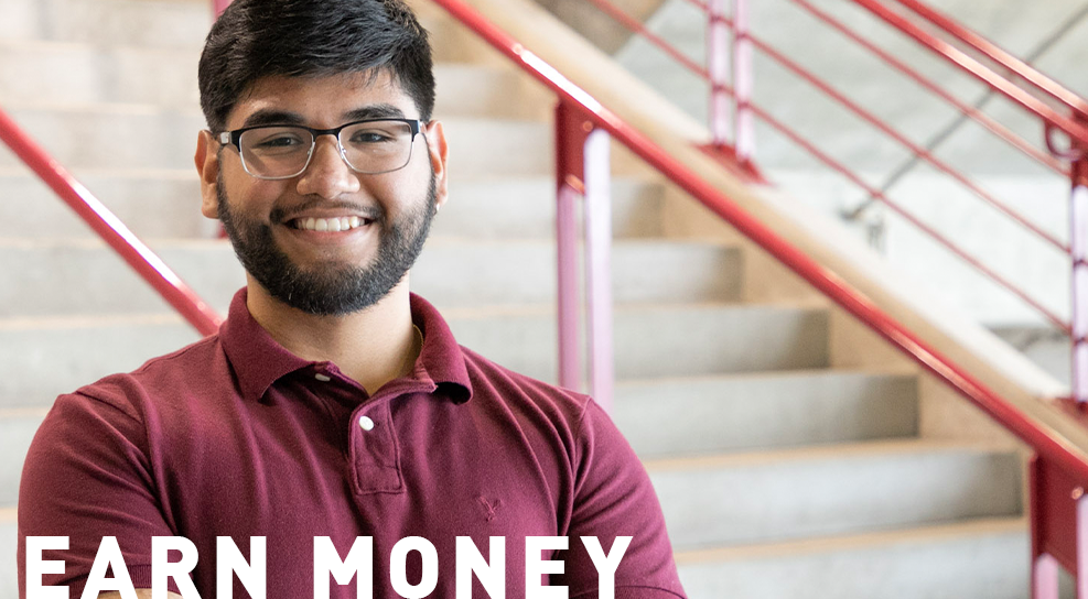 Male student smiling at camera