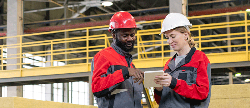 Two people working in a production facility