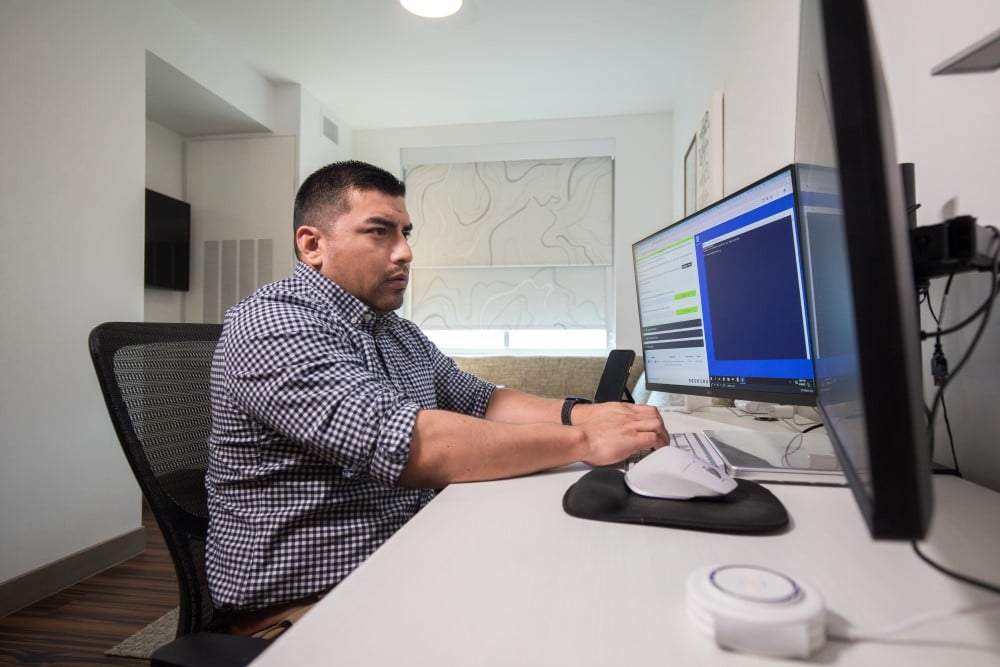 Alamo Colleges Online student studying with desktop