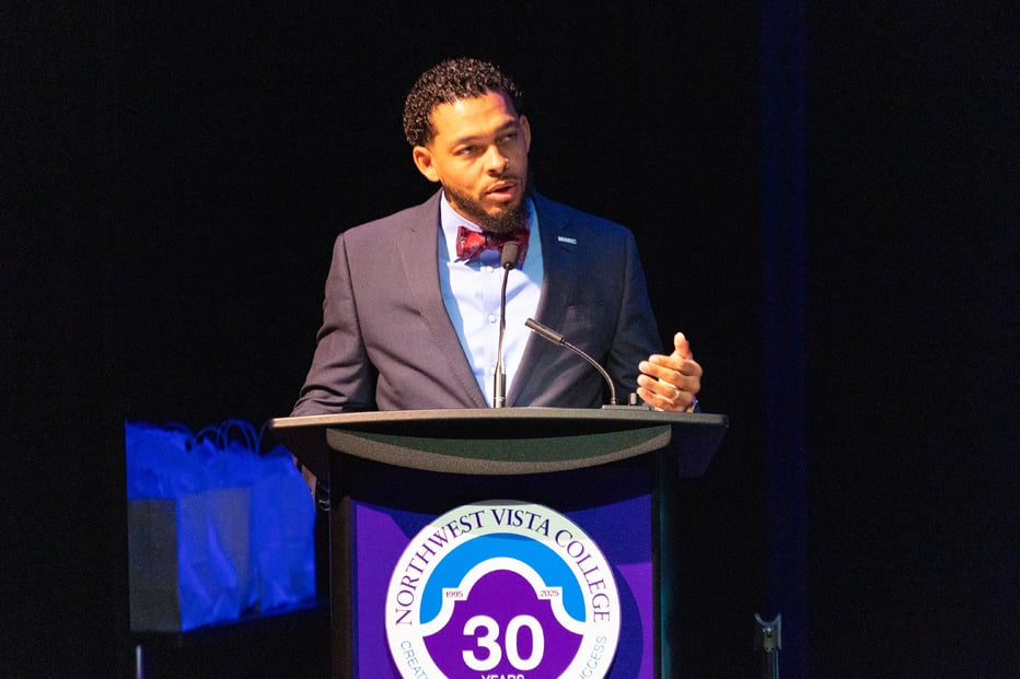 man speaking at podium