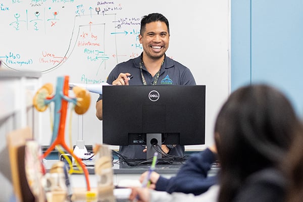 Alamo College faculty member in the classroom with students.