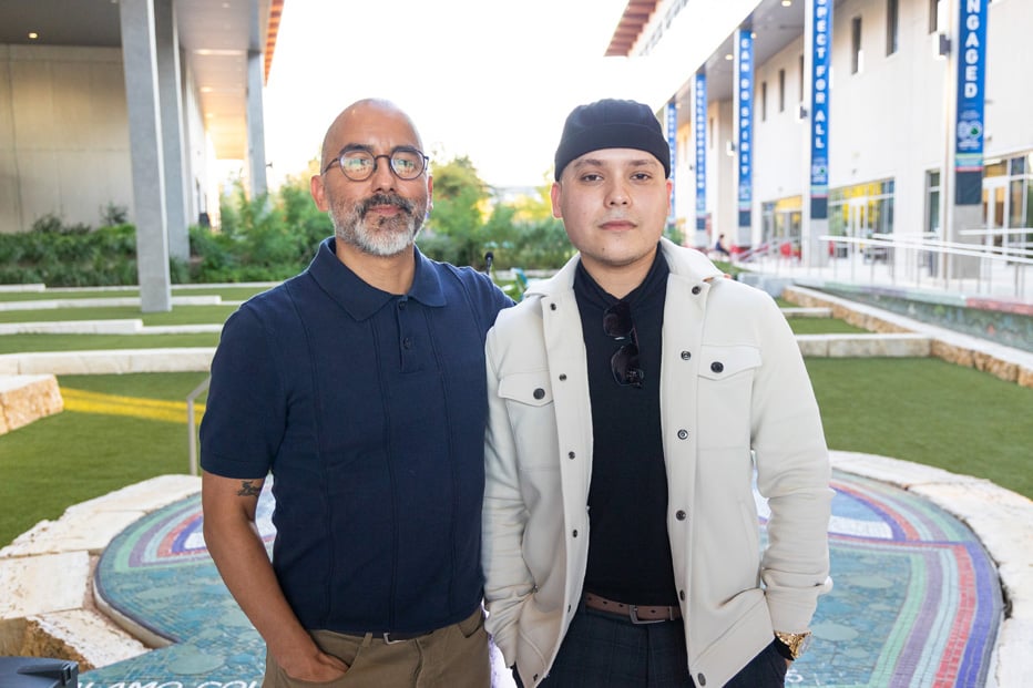 Vincent Valdez standing with male student