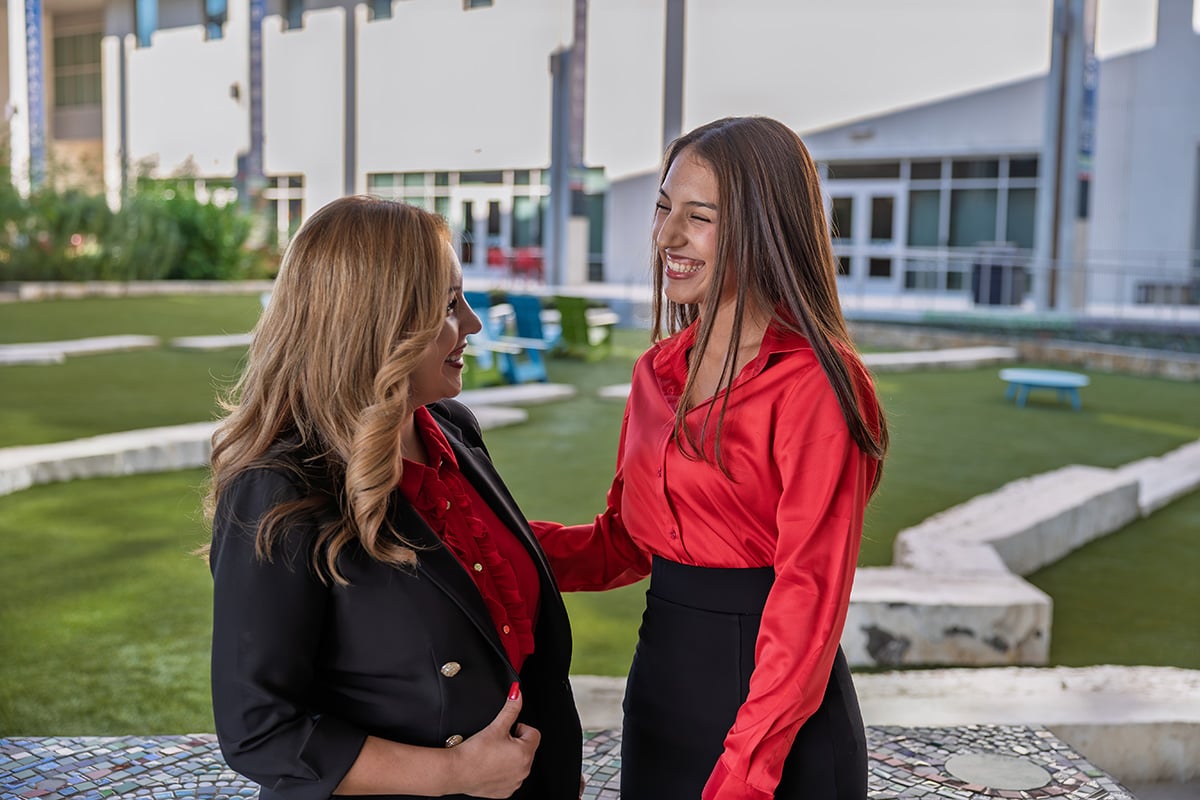 Rahmayah and her mother pose for picture