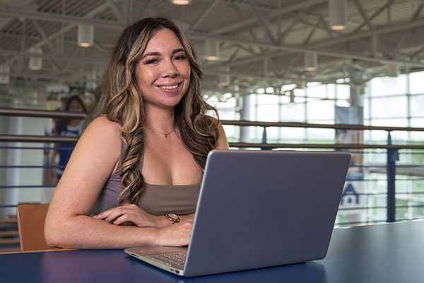 Aida on her laptop in the library.jpg