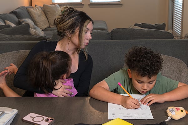 Aida and SPC student at home with her kids