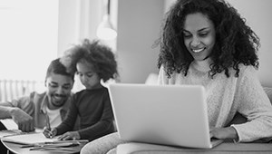 Photo of female student working on a laptop
