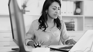 Alamo College female student studying on a laptop