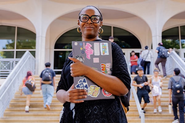 Alexuss Green an AlamoONLINE student standing for a photo