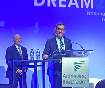 Chancellor Dr. Mike Flores accepting the 2020 Leah Meyer Award from Achieving the Dream in National Harbor, Maryland