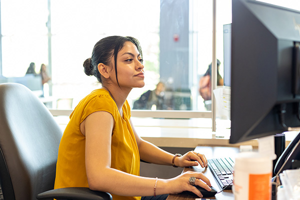 Woman using a desktop computer